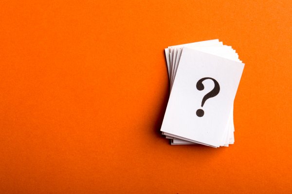 restoro system optimizer question mark on piece of paper orange background